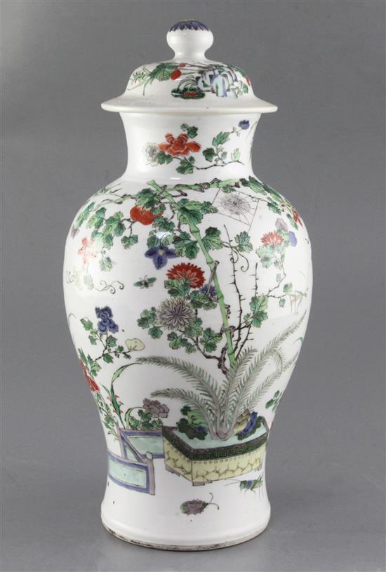 A Chinese famille verte vase and cover, late 19th century, height 37.5cm, hairline crack to rim, wood stand